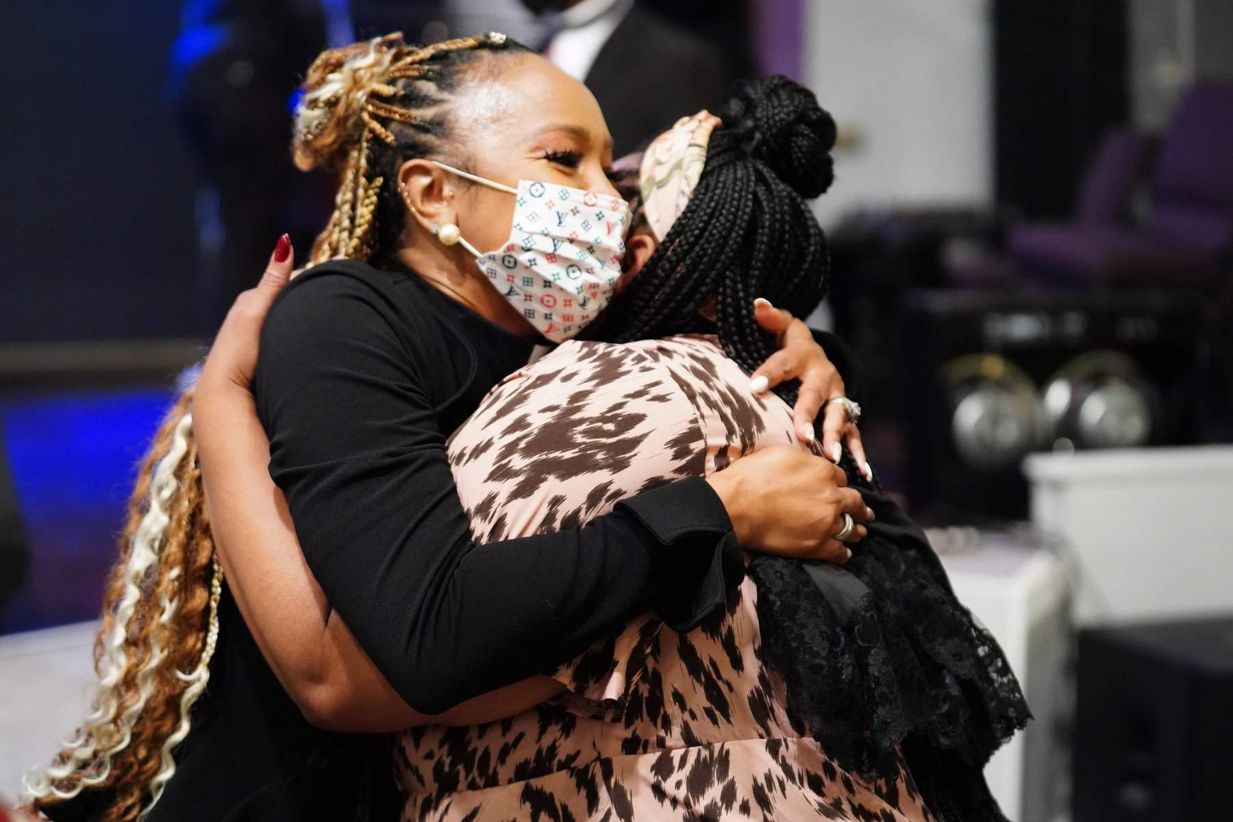 Members embracing at New Hope Cathedral